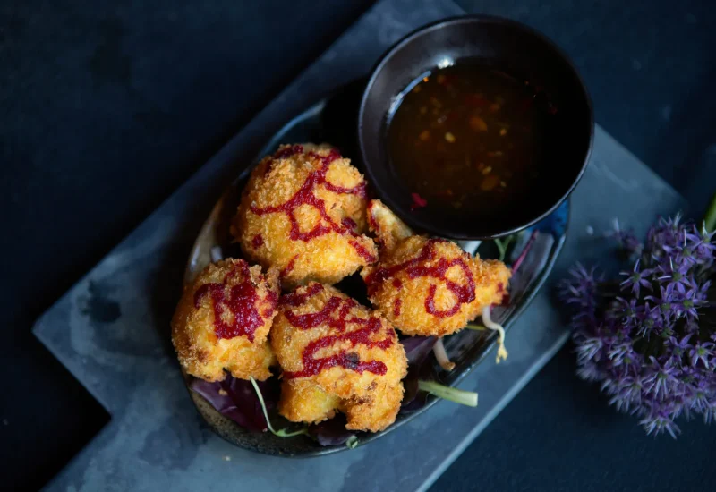 asian-fried-vegetables-with-sauce-dark-background-closeup-scaled